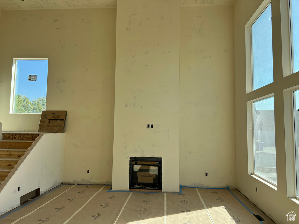 Unfurnished living room with a healthy amount of sunlight