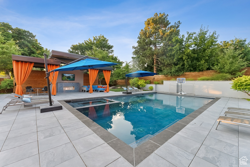 View of swimming pool with a patio