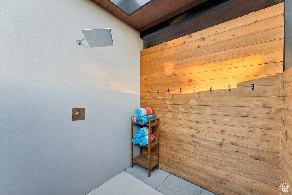 Interior space featuring wooden ceiling and tile patterned flooring