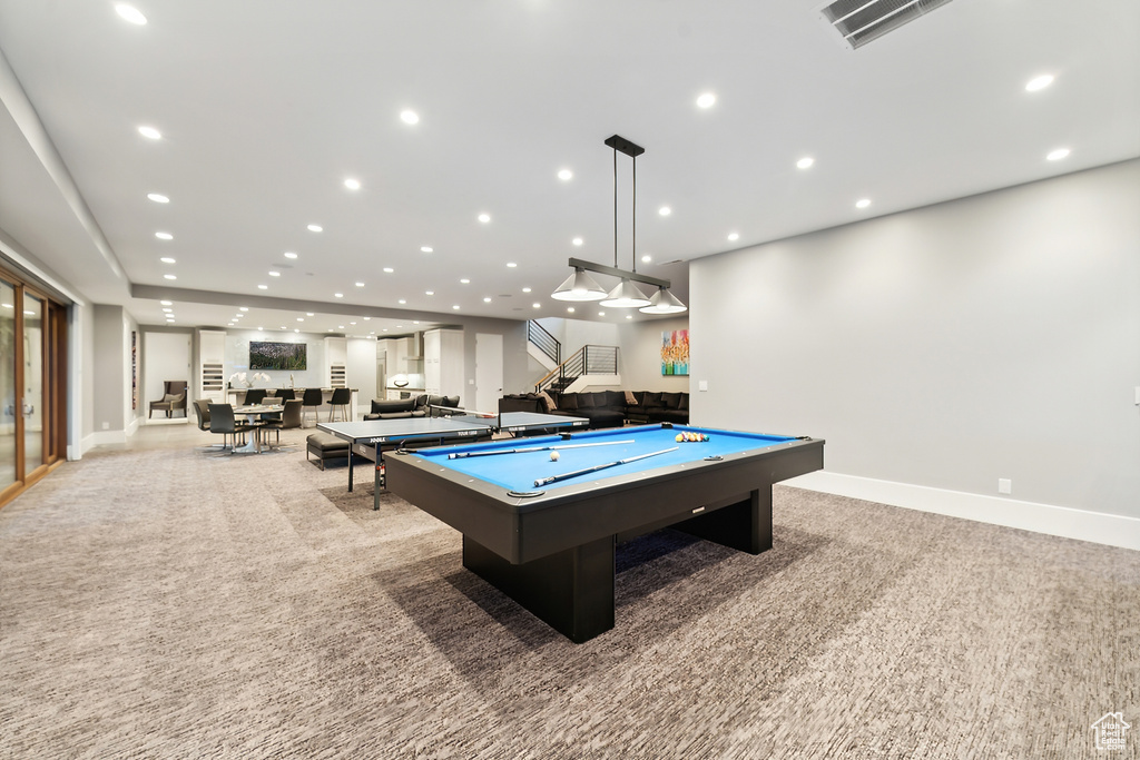 Game room featuring billiards and light carpet