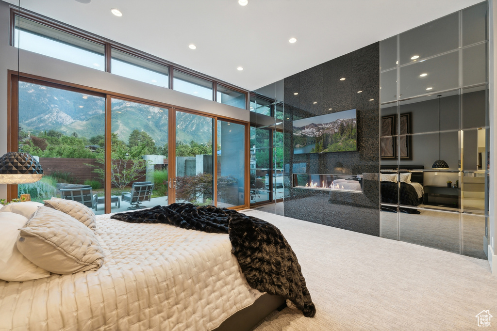 Bedroom featuring a mountain view and carpet flooring