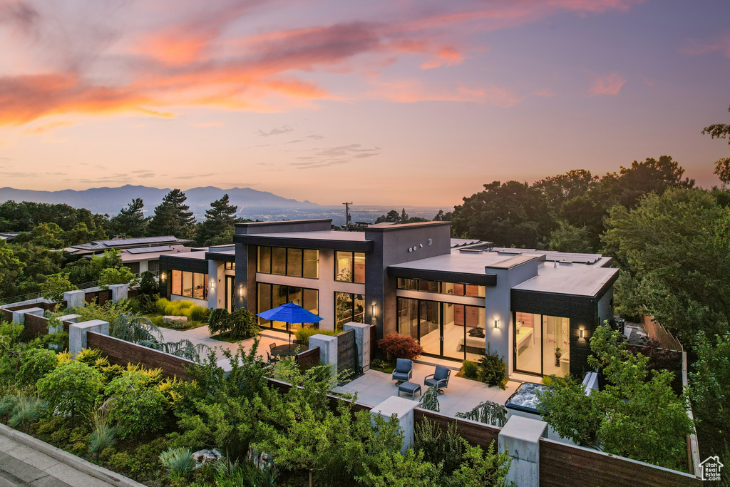 Back house at dusk with a mountain view