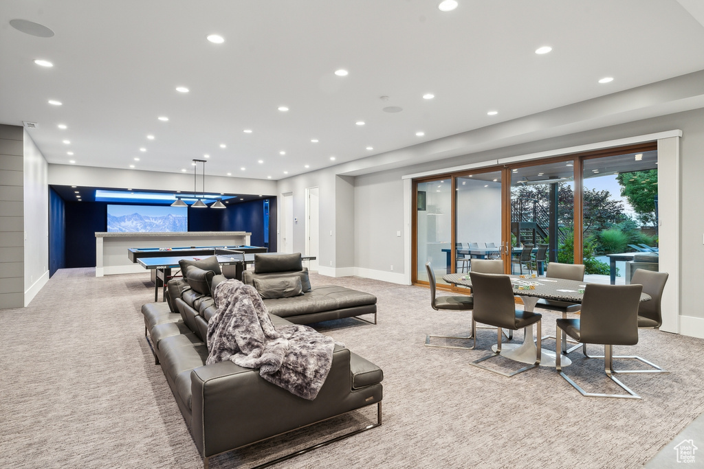 Living room featuring pool table and light carpet