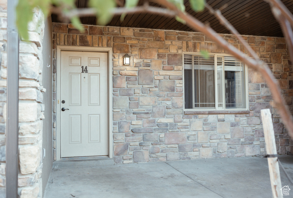 Entrance to property featuring a patio