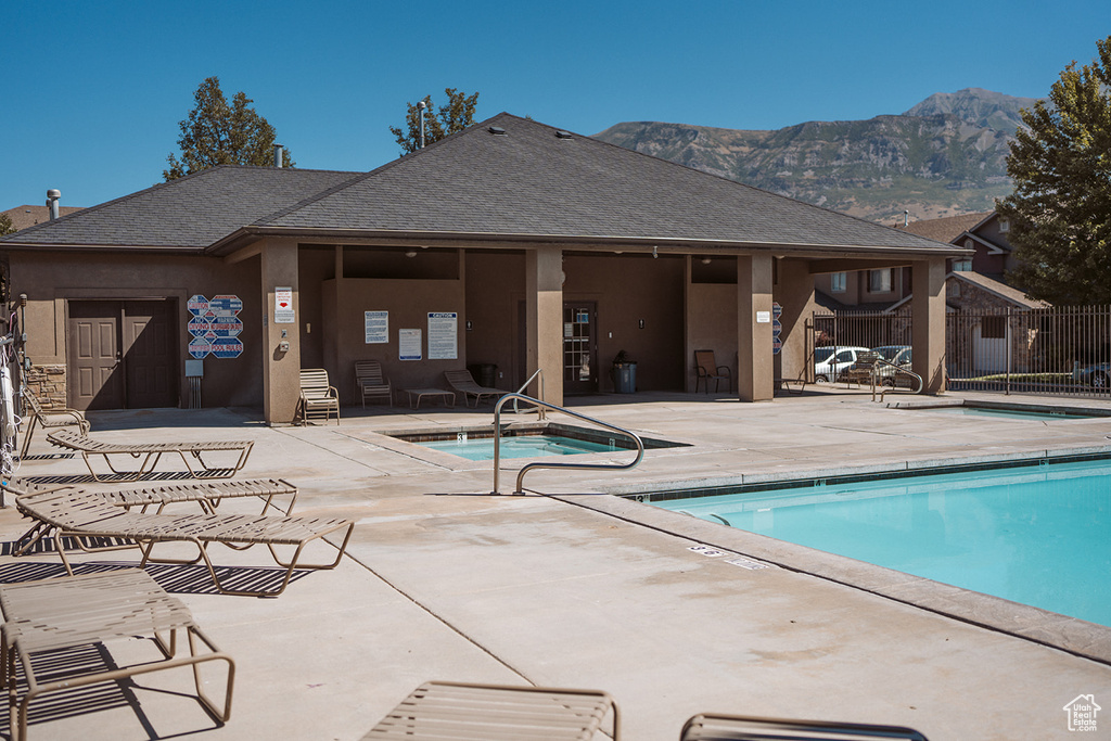 View of pool featuring a patio area and a mountain view