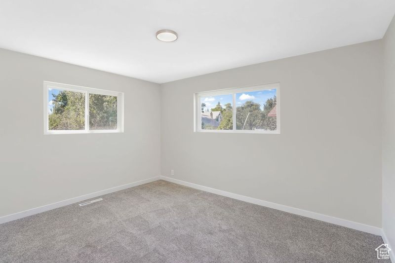 View of carpeted spare room