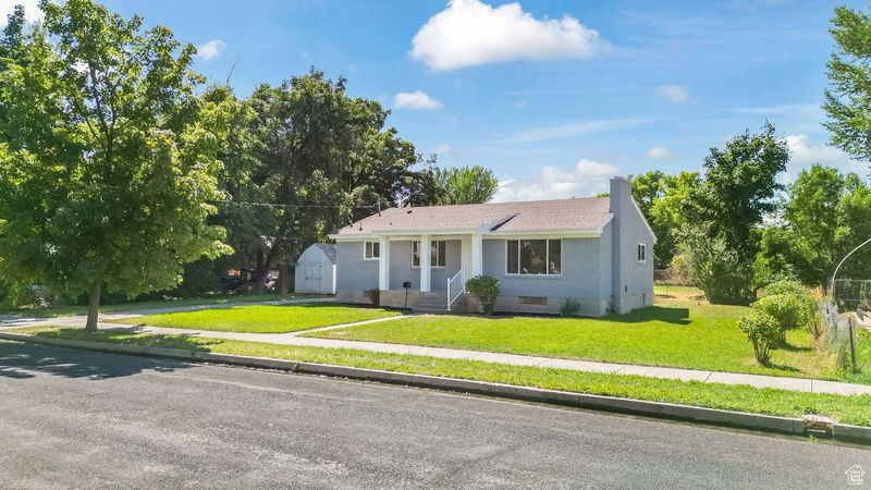 Ranch-style home with a front lawn