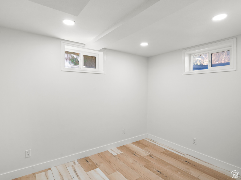 Basement featuring light hardwood / wood-style floors