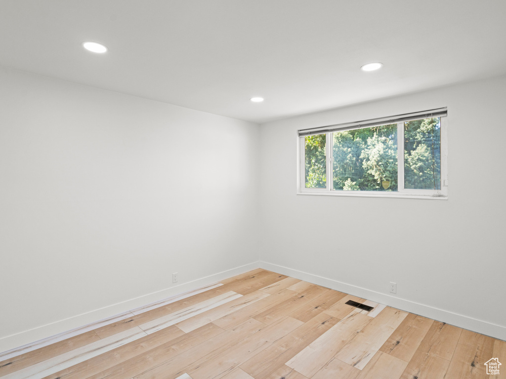 Empty room featuring light wood-type flooring