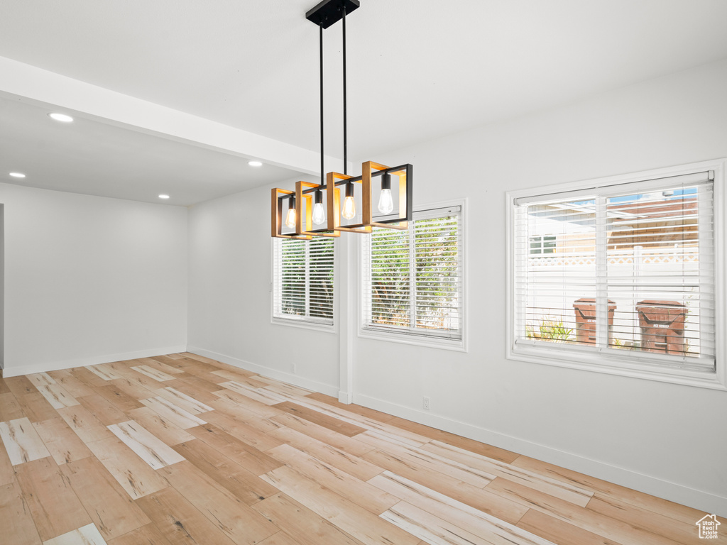 Unfurnished dining area with light wood-type flooring