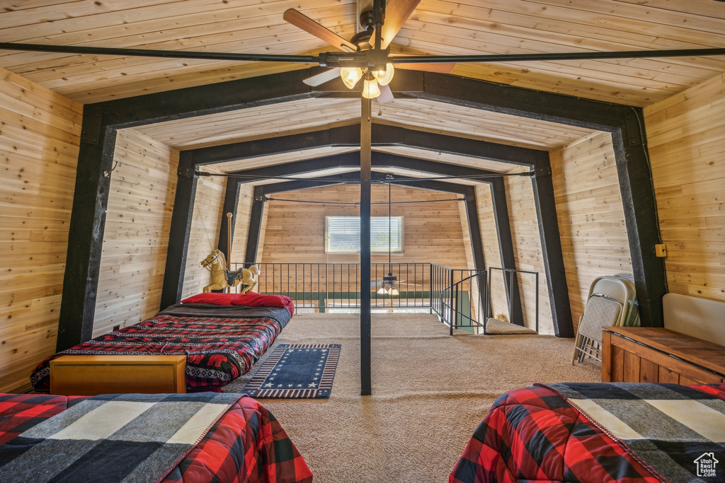 Bedroom with ceiling fan, carpet flooring, lofted ceiling, and wood ceiling