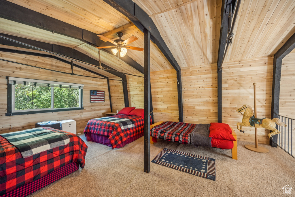 Carpeted bedroom with wood ceiling, wooden walls, and vaulted ceiling with beams