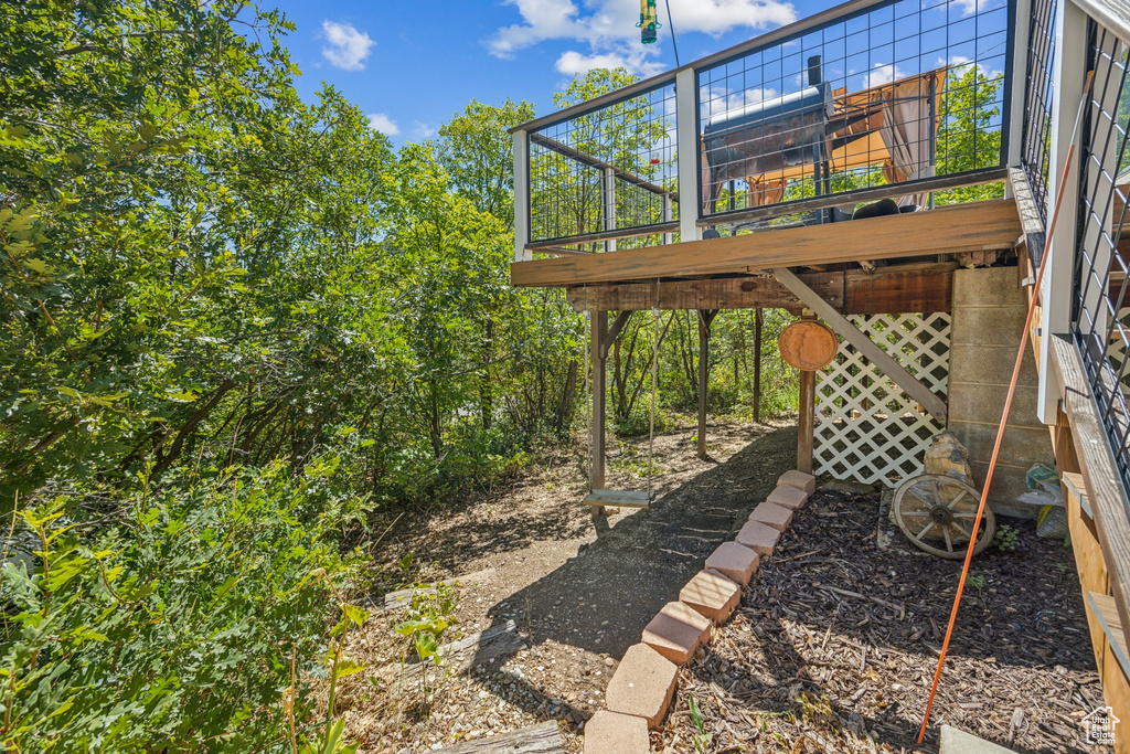 View of yard with a wooden deck