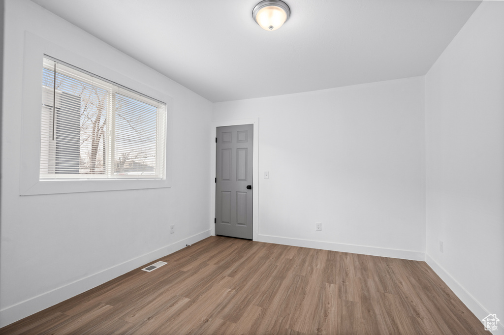 Unfurnished room featuring wood-type flooring