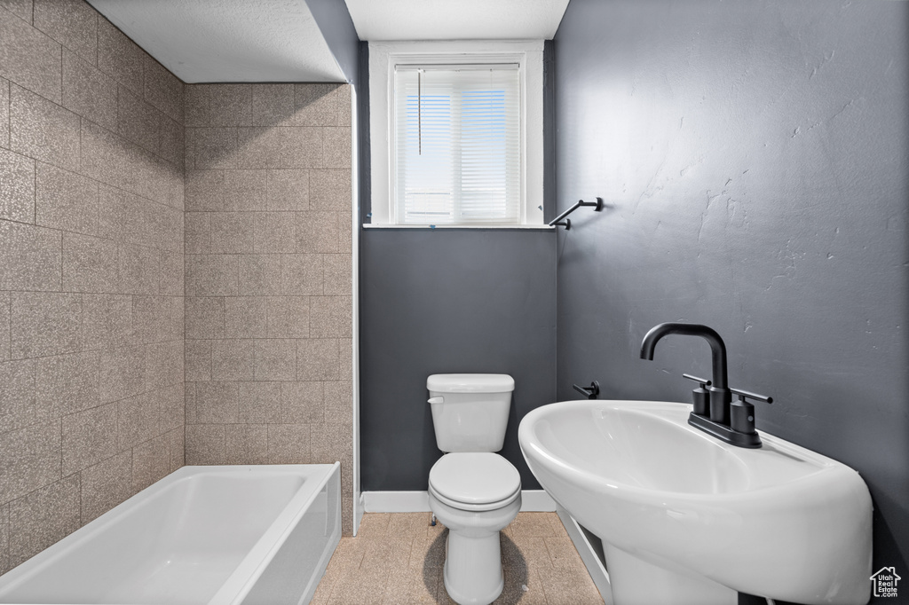 Bathroom with sink and toilet