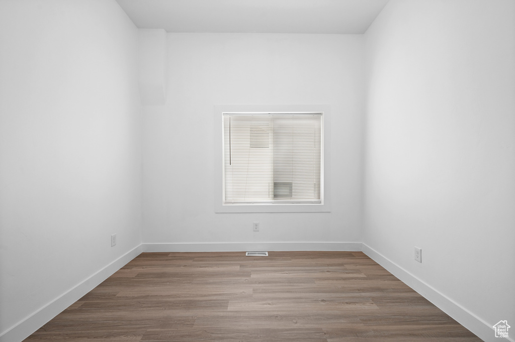 Spare room with wood-type flooring