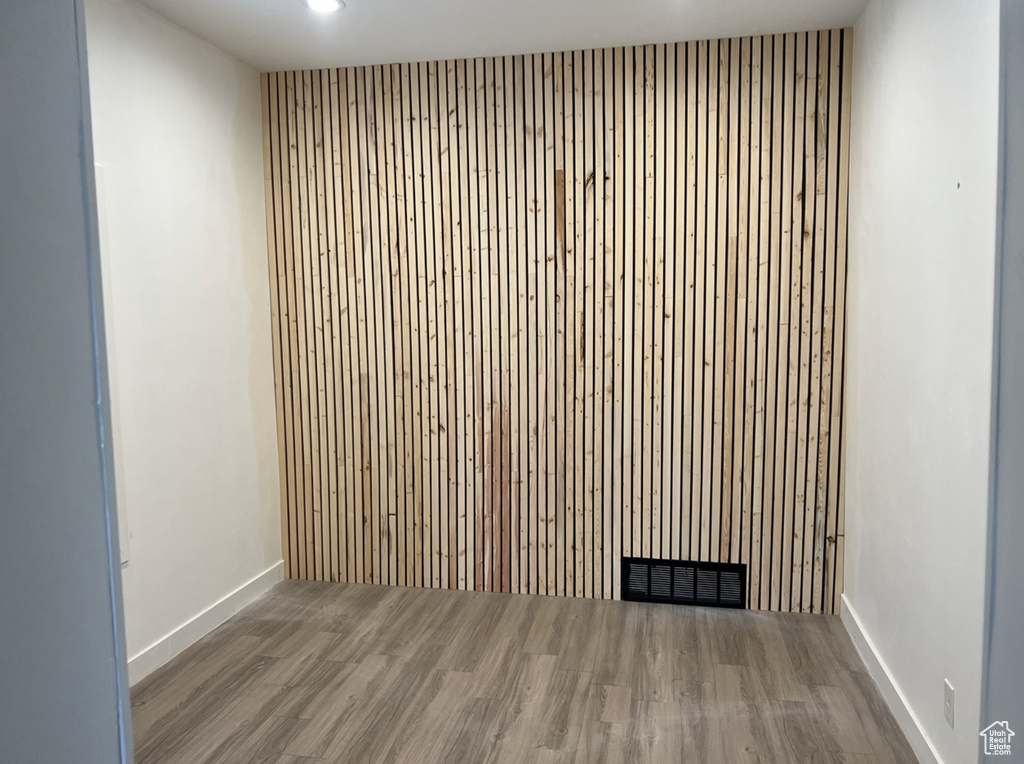 Unfurnished room with hardwood / wood-style floors