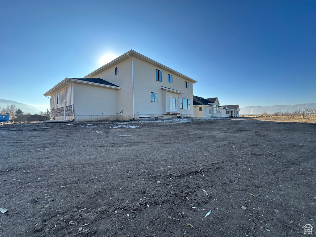 Rear view of house featuring a mountain view