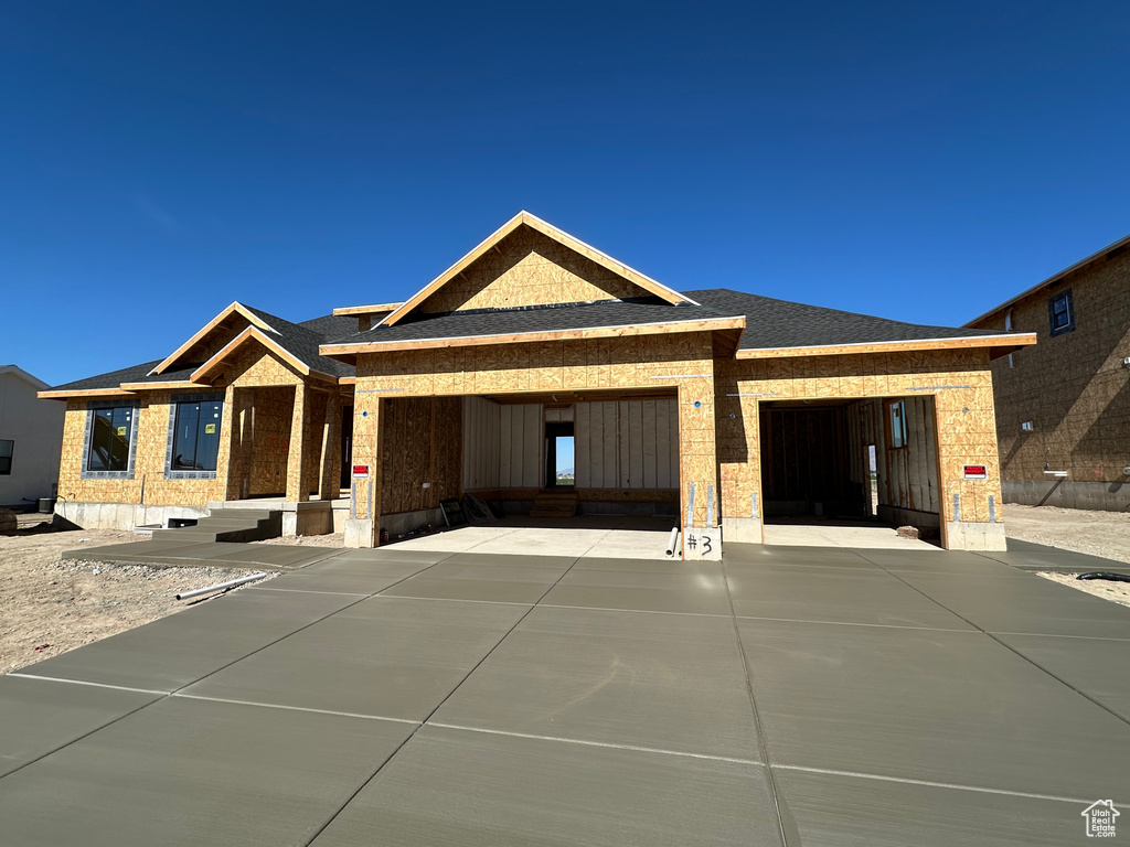 Property in mid-construction with a garage