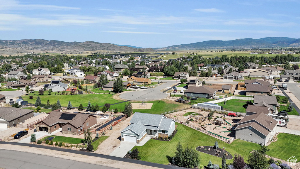 Birds eye view of property with a mountain view