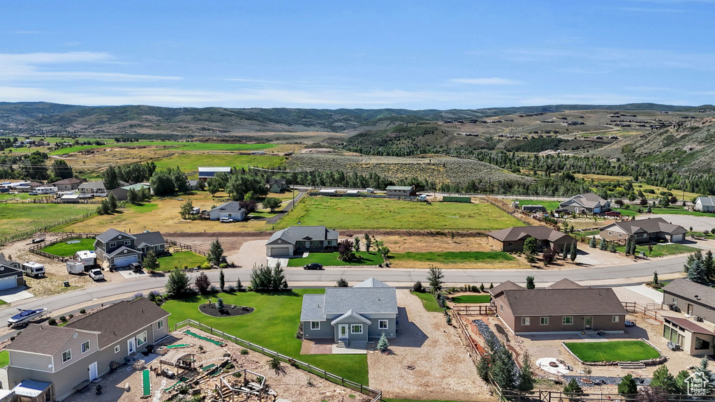 Birds eye view of property with a mountain view