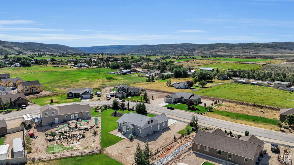 Birds eye view of property with a mountain view