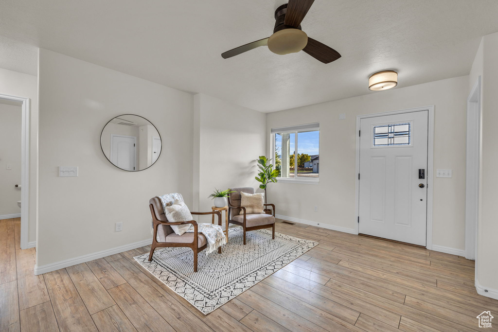 Entryway featuring light hardwood / wood-style floors and ceiling fan