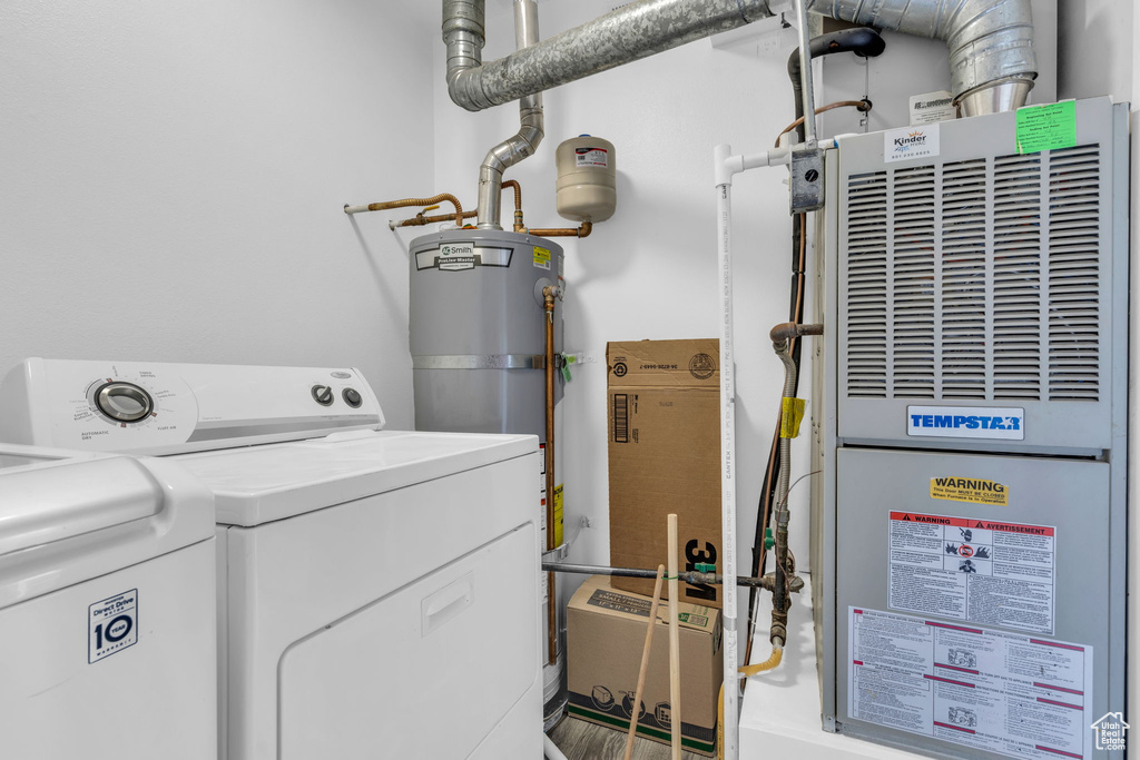 Interior space with independent washer and dryer, heating unit, and water heater