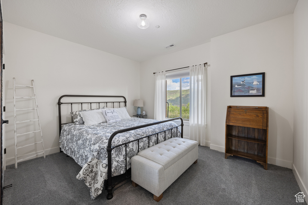 Bedroom featuring carpet flooring