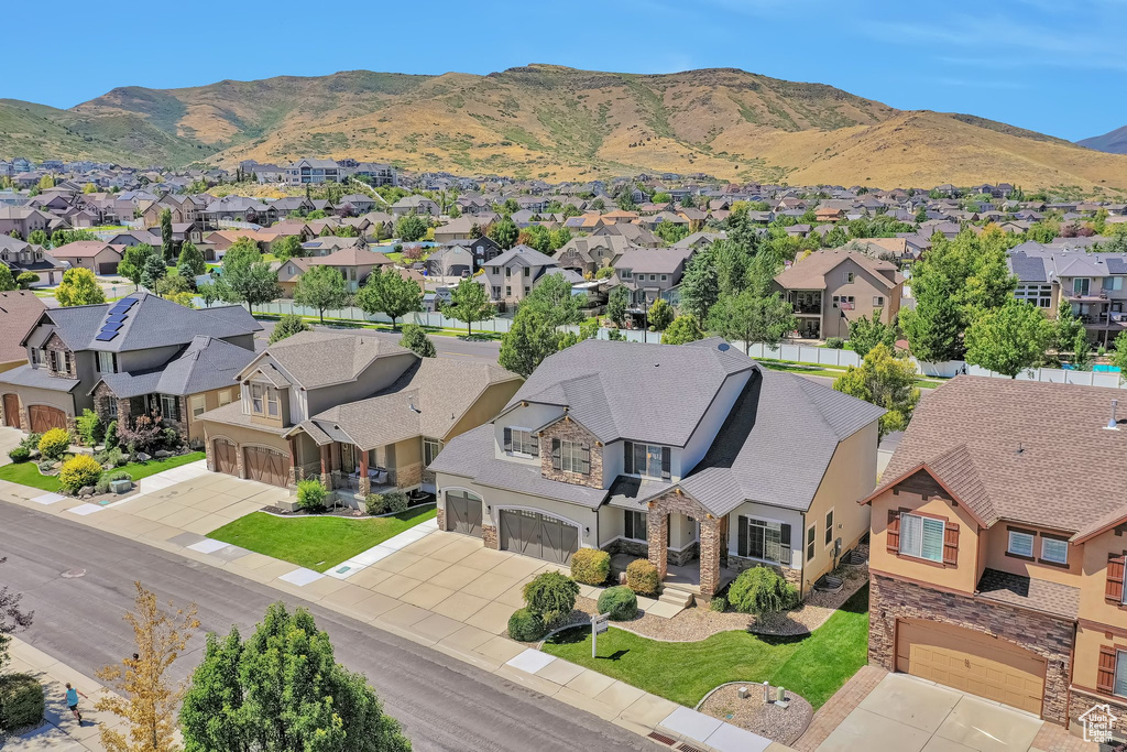 Birds eye view of property with a mountain view