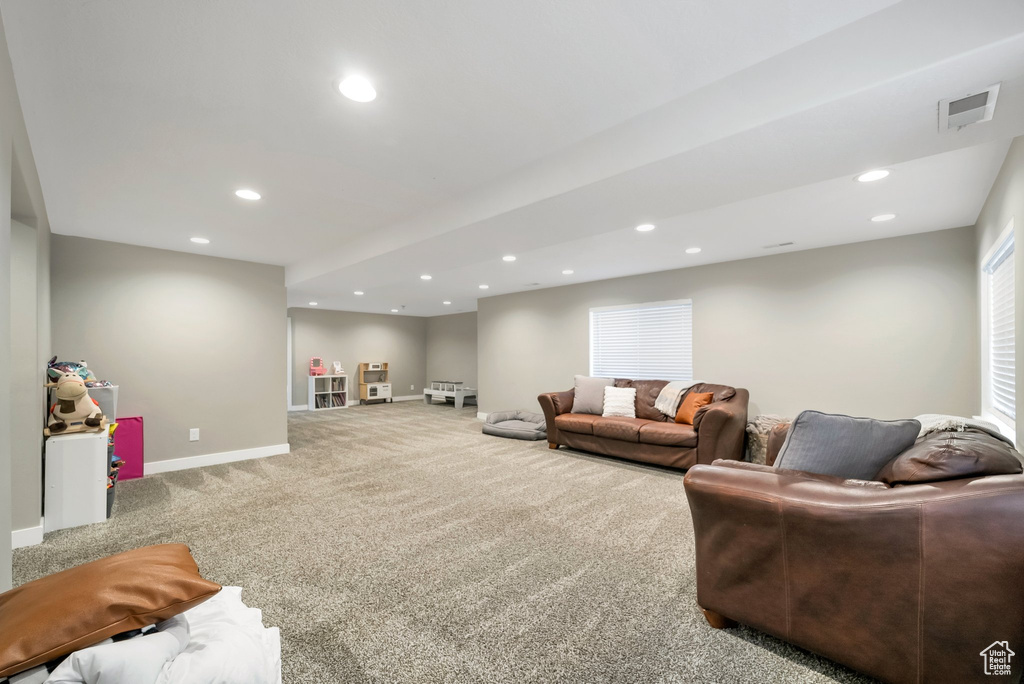 Living room featuring light carpet