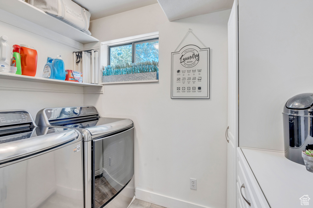 Washroom with washing machine and clothes dryer