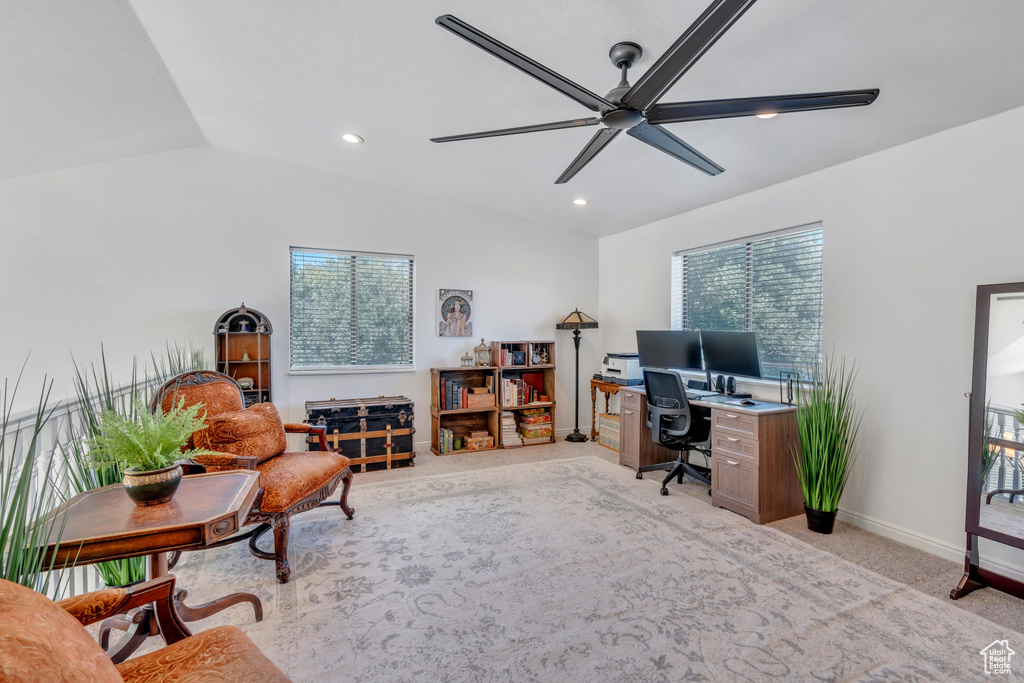 Carpeted office with ceiling fan and lofted ceiling