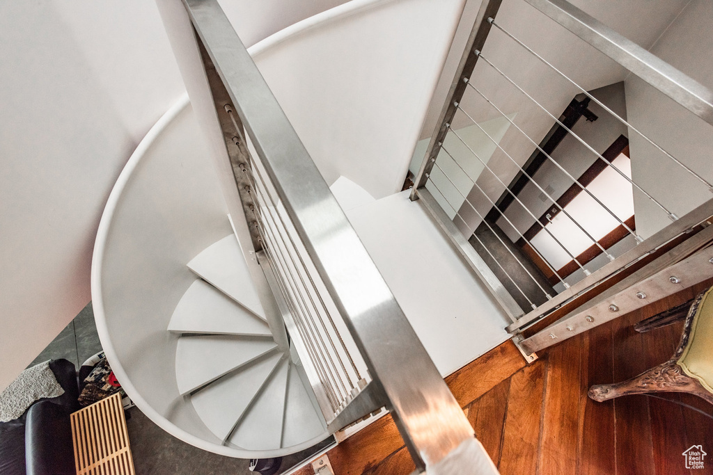 Stairs with hardwood / wood-style floors