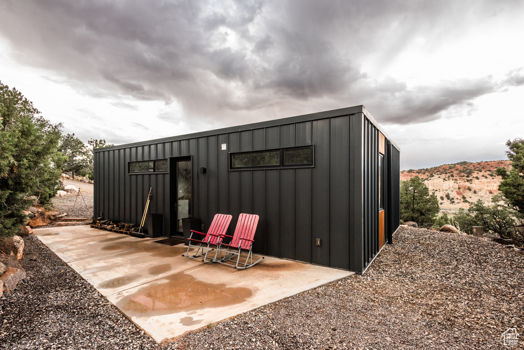 View of outbuilding with a mountain view