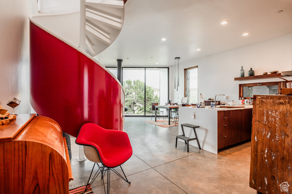 Interior space featuring sink and floor to ceiling windows