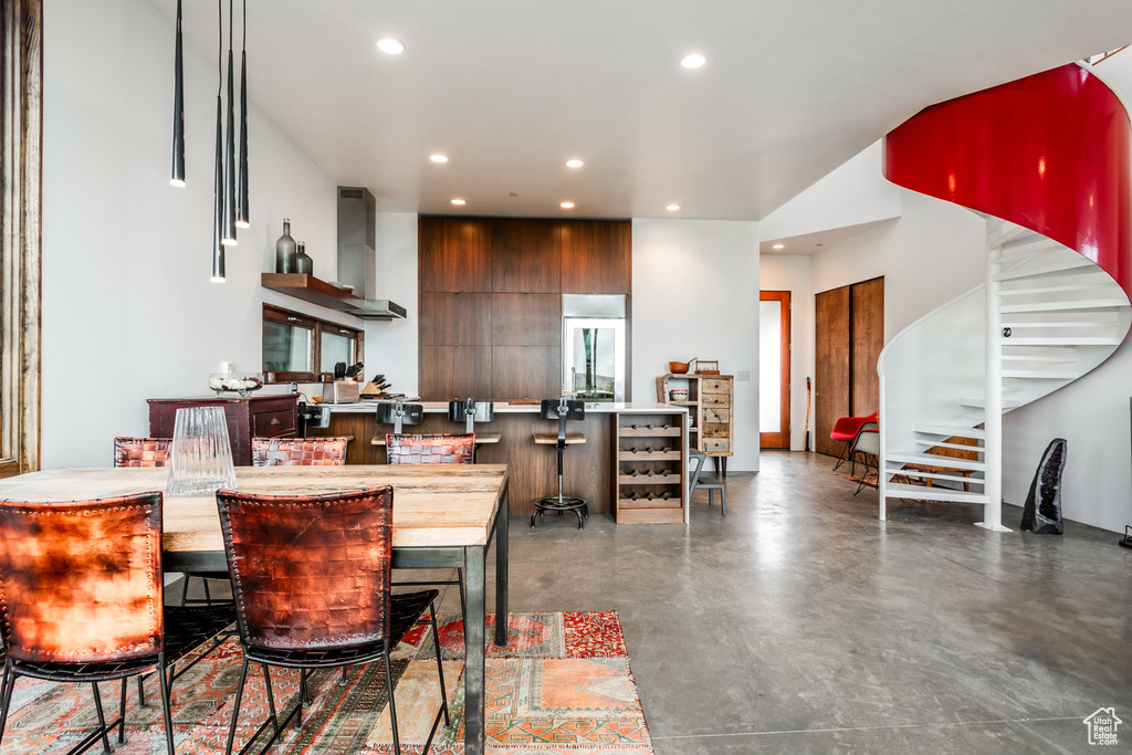 Dining area featuring concrete flooring