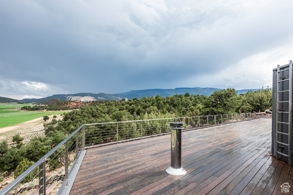 Wooden deck featuring a mountain view