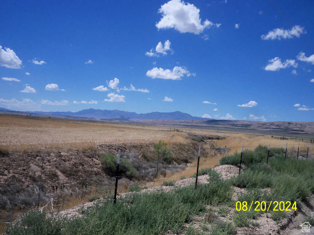Property view of mountains with a rural view
