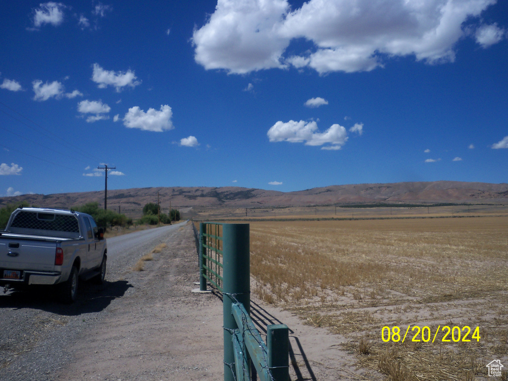 View of road with a rural view and a mountain view