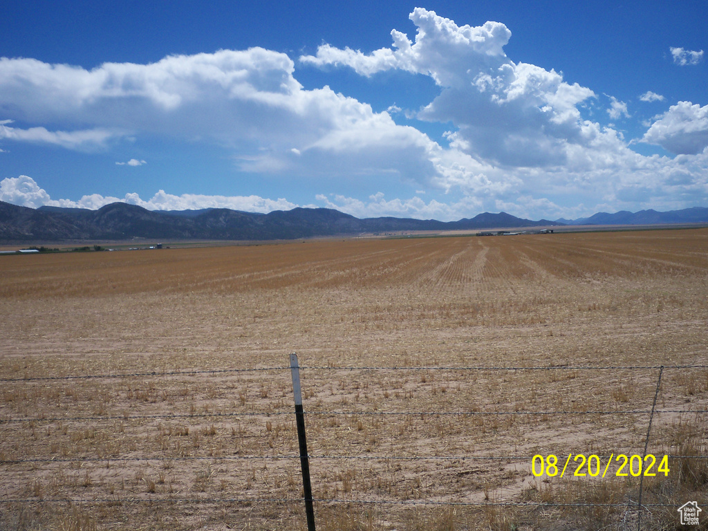Property view of mountains with a rural view
