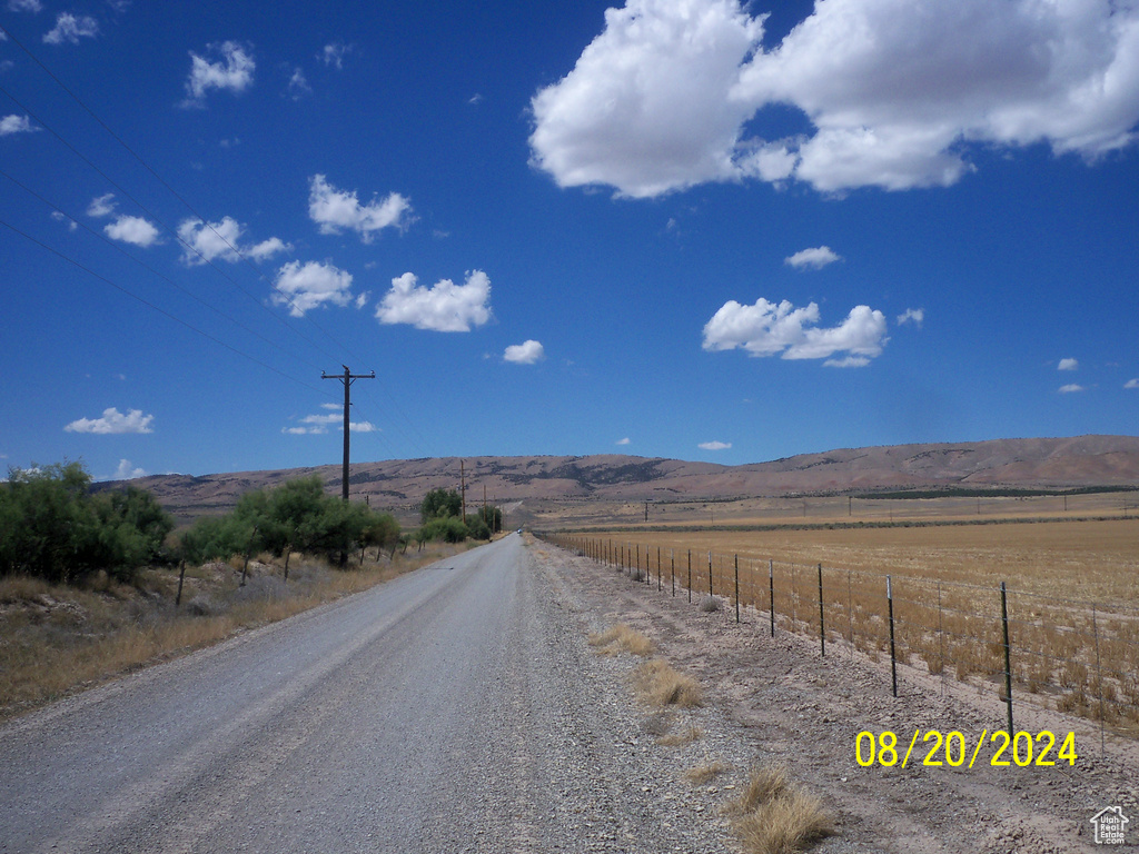 View of street featuring a rural view and a mountain view