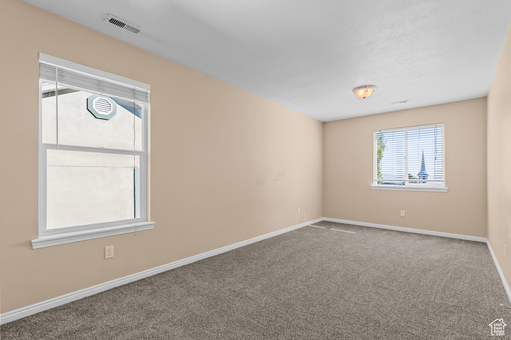 Empty room with carpet flooring