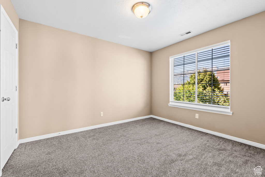 Empty room with carpet floors