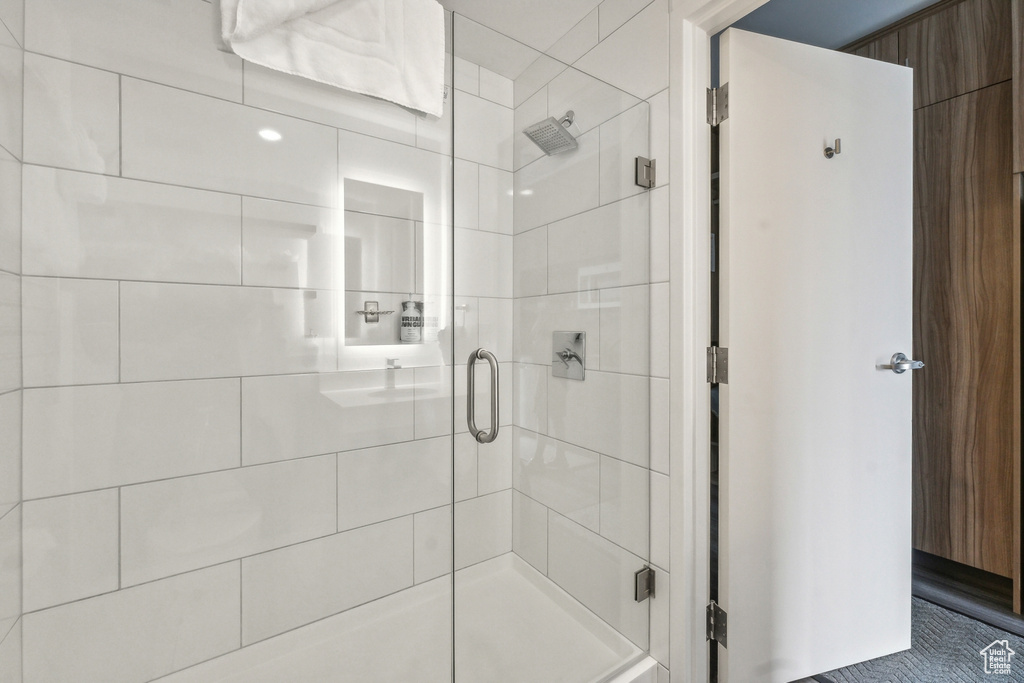 Bathroom with a shower with door