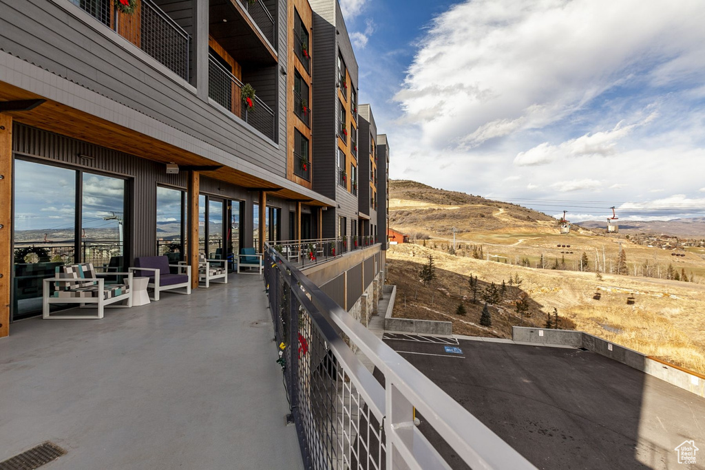 View of patio featuring a balcony and outdoor lounge area