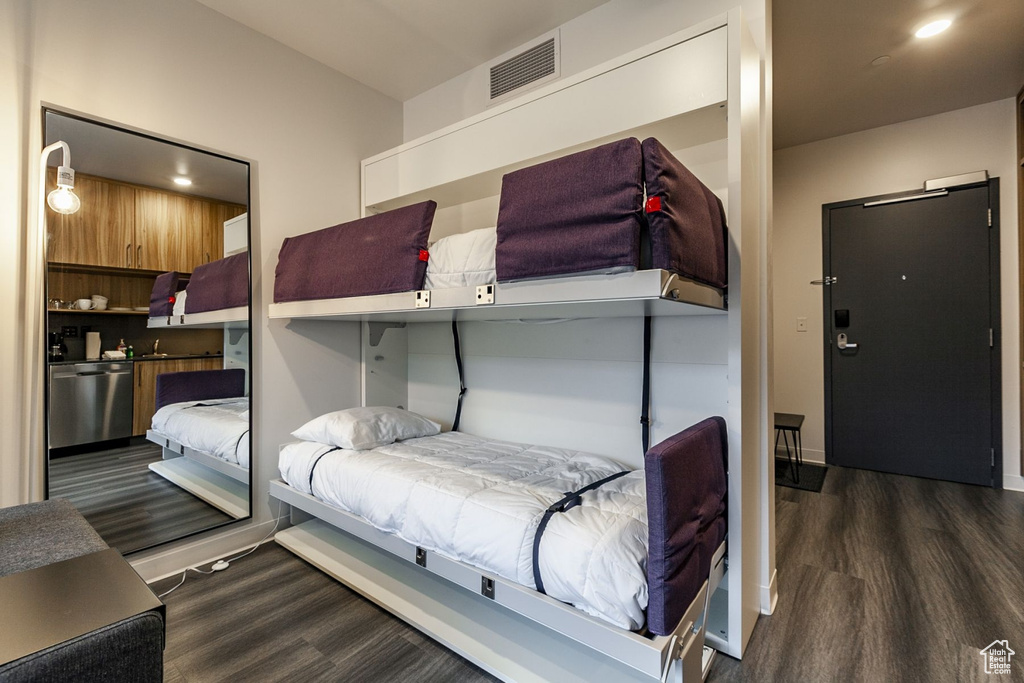 Bedroom featuring dark wood-type flooring