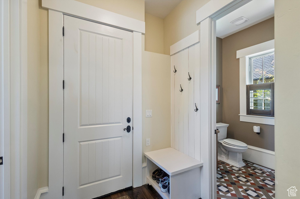 Mudroom featuring dark tile patterned floors