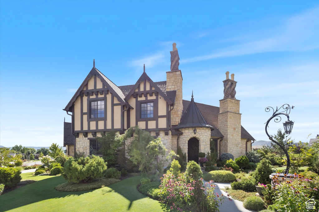 Tudor-style house with a front lawn