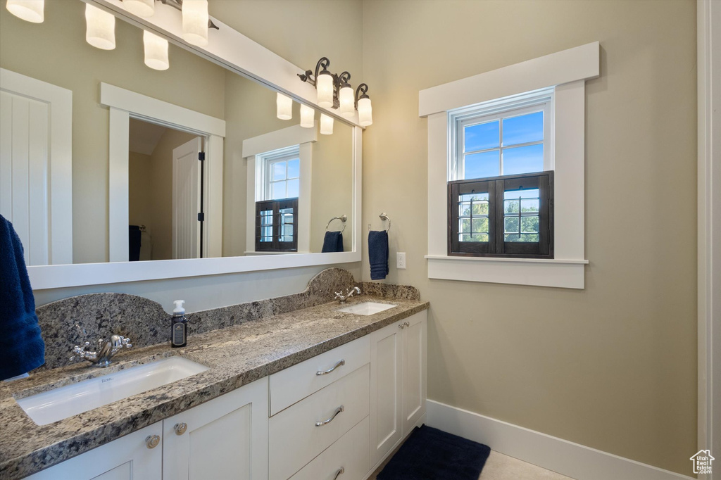 Bathroom with plenty of natural light and dual bowl vanity